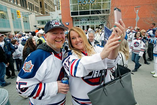 PHIL HOSSACK / WINNIPEG FREE PRESS - STREET PARTY - Everybody, including Dan Brown and Kristin Warner were making sure they had a selfie at the Jets Whiteout Party Tuesday.   Jessica's story.  - May 1, 2018