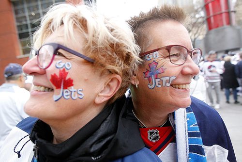 PHIL HOSSACK / WINNIPEG FREE PRESS - STREET PARTY - Jets fans Heidi Streu (left) and Judy Wilson show off matching face tattos at the Jets Whiteout Party Tuesday.   Jessica's story.  - May 1, 2018
