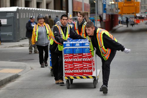 PHIL HOSSACK / WINNIPEG FREE PRESS - STREET PARTY - Beer and more beer wheeled onto Donald and Graham ave by workers assembling the party area. Jessica's story.  - May 1, 2018