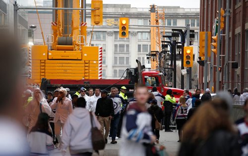 PHIL HOSSACK / WINNIPEG FREE PRESS - STREET PARTY - Dump trucks block street access preventing vehicle traffic and incidents like the one in Toronto last week on downtown streets for the Jets Whiteout Party Tuesday.   Jessica's story.  - May 1, 2018