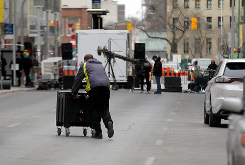 PHIL HOSSACK / WINNIPEG FREE PRESS - STREET PARTY - Workers wheel carts down Donald street assembling the party area. Jessica's story.  - May 1, 2018