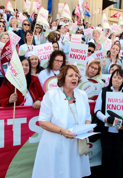BORIS MINKEVICH / WINNIPEG FREE PRESS
Around 700 nurses and supporters converged on to the steps of the Manitoba Legislature today to protest against healthcare cuts. President of the 12,000 member Manitoba Nurses Union Sandi Mowat, centre, speaks at the event. JANE GERSTER STORY.  May 2, 2018