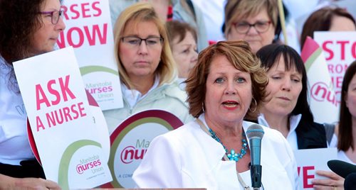 BORIS MINKEVICH / WINNIPEG FREE PRESS
Around 700 nurses and supporters converged on to the steps of the Manitoba Legislature today to protest against healthcare cuts. President of the 12,000 member Manitoba Nurses Union Sandi Mowat, at the mic, speaks at the event. JANE GERSTER STORY.  May 2, 2018