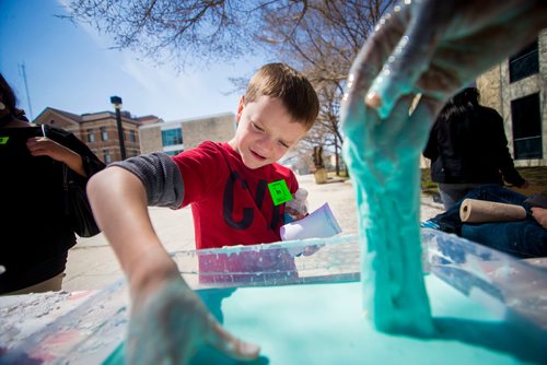 MIKAELA MACKENZIE / WINNIPEG FREE 
Brett Schnell, a grade three student, plays with "oobleck" (a mixture of corn starch and water) at Discovery Days at the University of Manitoba in Winnipeg on Thursday, May 3, 2018. The event is an art-science-engineering mash-up with hands-on messy activities, "potions" classes, and more.
Mikaela MacKenzie / Winnipeg Free Press 2018.