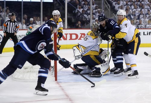 TREVOR HAGAN / WINNIPEG FREE PRESS
Winnipeg Jets' Josh Morrissey (44) fires a shot on Nashville Predators' goaltender Pekka Rinne (35) who would make an incredible stick save during first period NHL playoff hockey action during game 4 of the second round, Thursday, May 3, 2018.