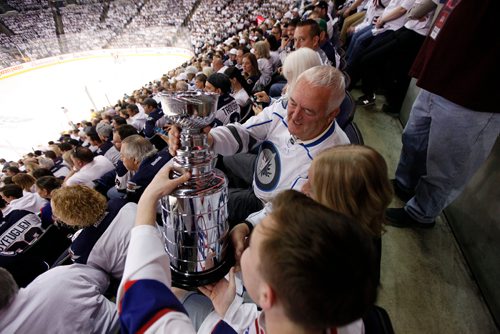 PHIL HOSSACK / Winnipeg Free Press - Winnipeg Jets fans pass around a Stanley Cup freplica in the first period of NHL game four playoff action in Winnipeg on Wednesday, May 3, 2018.
