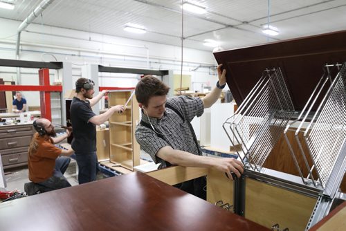 RUTH BONNEVILLE / WINNIPEG FREE PRESS

Business: Springfield Woodworking on Springfield Colony, GM Pauly Kleinsasser.

Photo of Nathan Wollman, who is from the colony, as he checks the inside of a cabinet with other workers in the background who are not from the colony, as they work in their busy shop located on Springfield Colony. 

Story on a very successful Hutterite company that  has become third largest kitchen cabinet maker in MB, and employs 60 people, 45 people from off-colony

See Bill Redekop story. 

May 03,  2018
