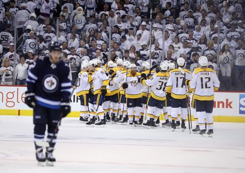 TREVOR HAGAN / WINNIPEG FREE PRESS
The Nashville Predators' celebrate defeating the Winnipeg Jets' at the end of the third period of NHL playoff hockey action during game 4 of the second round, Thursday, May 3, 2018.