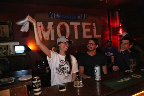 MIKE DEAL / WINNIPEG FREE PRESS
Rebecca Sandulak from Carman, MB, cheers during the Winnipeg Jets playoff game against the Nashville Predators while at the Toronto bar Motel Thursday night. 
180504 - Friday, May 4, 2018.