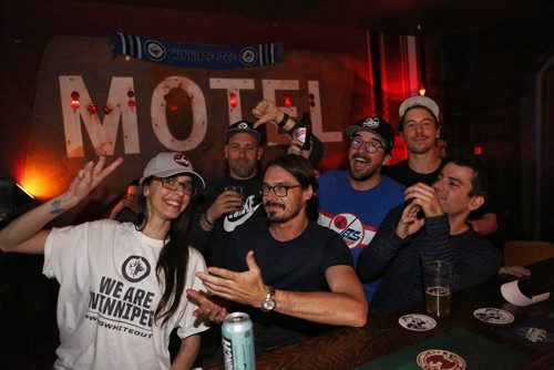 MIKE DEAL / WINNIPEG FREE PRESS
Fans cheer during the Winnipeg Jets playoff game against the Nashville Predators while at the Toronto bar Motel Thursday night. 
180504 - Friday, May 4, 2018.