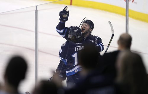 TREVOR HAGAN / WINNIPEG FREE PRESS
Manitoba Moose Brendan Lemieux (48) and Nic Petan (19) celebrate after Lemieux scored on Rockford Icehogs goaltender, Collin Delia (1) during the first period of their second round AHL playoff matchup, Saturday, May 5, 2018.
