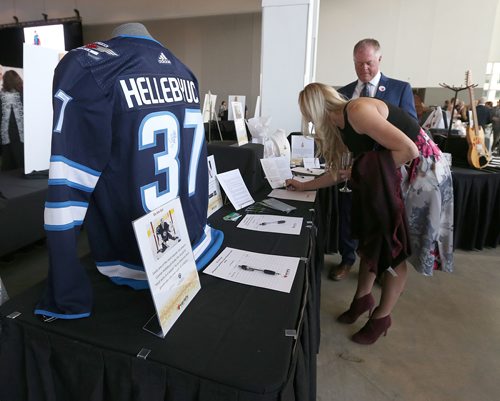 JASON HALSTEAD / WINNIPEG FREE PRESS

Attendees check out auction items at Variety's 2018 Gold Heart Gala at the RBC Convention Centre Winnipeg on April 14, 2018. (See Social Page)