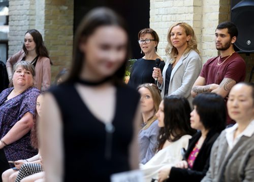 TREVOR HAGAN / WINNIPEG FREE PRESS
Jennifer Milner, of Panache Management, acting as MC with the microphone during a model search at The Forks, Sunday, May 6, 2018.