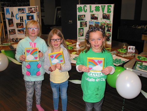 Canstar Community News April 28 - La Salle 4-H Club Cloverbud members (from left) Sydney Lewko, Payton Manness and Claire Boyd participate in the club's achievement at the La Salle Community Fellowship on April 28. (ANDREA GEARY/CANSTAR COMMUNITY NEWS)