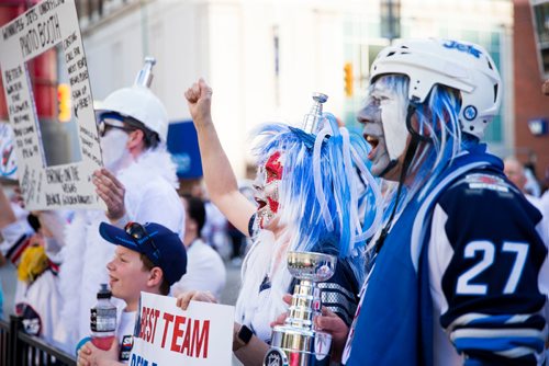 MIKAELA MACKENZIE / WINNIPEG FREE PRESS
Sheila Hathaway cheers for the cameras at the whiteout street party in Winnipeg on Monday, May 7, 2018. 
Mikaela MacKenzie / Winnipeg Free Press 2018.