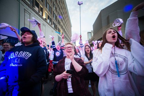 MIKAELA MACKENZIE / WINNIPEG FREE PRESS
Sam Mantik (centre) cheers before the game starts at the whiteout street party in Winnipeg on Monday, May 7, 2018. 
Mikaela MacKenzie / Winnipeg Free Press 2018.