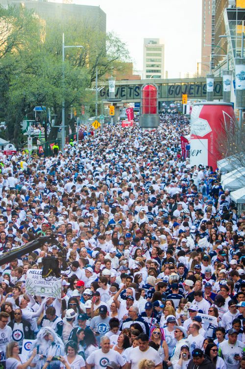 MIKAELA MACKENZIE / WINNIPEG FREE PRESS
Jets fans arrive at Donald Street for the whiteout street party in Winnipeg on Monday, May 7, 2018. 
Mikaela MacKenzie / Winnipeg Free Press 2018.