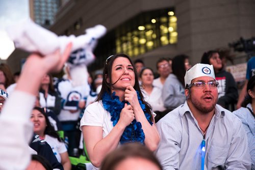 MIKAELA MACKENZIE / WINNIPEG FREE PRESS
Nina Poric (left) and Oladele Akano react to a tense game at the whiteout street party in Winnipeg on Monday, May 7, 2018. 
Mikaela MacKenzie / Winnipeg Free Press 2018.