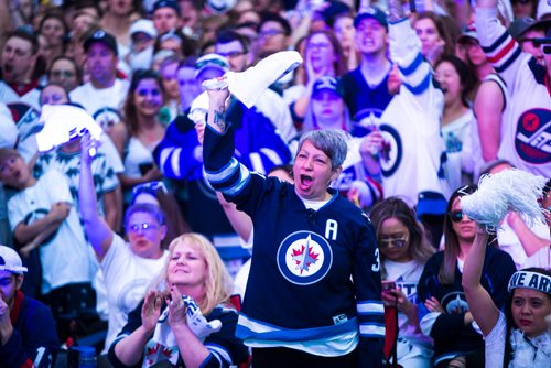 MIKAELA MACKENZIE / WINNIPEG FREE PRESS
Tina Quesnel cheers at the whiteout street party in Winnipeg on Monday, May 7, 2018. 
Mikaela MacKenzie / Winnipeg Free Press 2018.