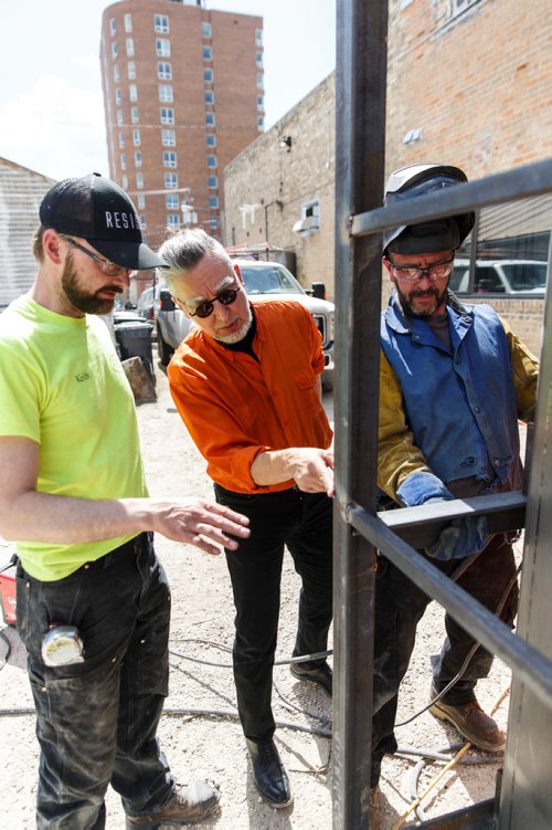 MIKE DEAL / WINNIPEG FREE PRESS
Keith Funk-Froese (left) with architect Wins Bridgman (centre) and construction worker John Smith (right) during the manufacture of the pop-up toilet at Keiths custom Sheet Metal shop. 
180507 - Monday, May 07, 2018.
