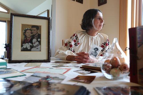 RUTH BONNEVILLE / WINNIPEG FREE PRESS

Passages feature on Olena Hryn.

Photo of Hher daughter, Mariika Hryn, with photos and memorabilia on table in her St. Vital home.   

Olena Hryn witnessed some of the most harrowing ordeals of the 20th century. 
Olena survived both the Soviet and Nazi occupations of her Ukrainian homeland, the Holodomor and the break-up of her family. Her father was a cleric forced into hiding. Her mother had to leave her in the care of relatives the worst winter of the famine--- in order to avoid being dragooned into Russian brigands that raided Ukrainian farms for their grain stores.
After the Second World War she as a refugee in a displaced persons camp. The Allies opened up local universities to  refugees and  Olena was finishing up her medical degree at a German university when she suddenly got a shot to come to Canada.

Her daughter, Mariika Hryn, sets out photos and memorabilia on table in her St. Vital home.   

See Alex Paul story

May 10,  2018
