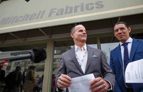 MIKE DEAL / WINNIPEG FREE PRESS
MP Robert-Falcon Ouellette (right) made a major announcement regarding the creation of the Multi-Billion dollar National Housing Co-Investment Fund in front of the former Mitchell Fabrics building which was recently purchased by The Main Street Project. Rick Lees (left), Executive Director for The Main Street Project, was on hand to talk about the opportunity the new funding avenue brings with regards to the work that his organization is doing.
180511 - Friday, May 11, 2018.