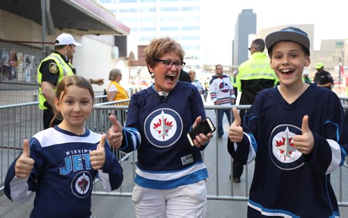 RUTH BONNEVILLE / WINNIPEG FREE PRESS
Alice Bourgouin and her two grandchildren Brady, 12, and Hannah, 9, can't hold back their excitement when they were allowed in to the Whiteout street party for Game 1 of the Western Conference final between the Jets and the Las Vegas Golden Knights.
