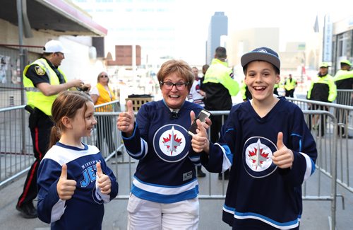 RUTH BONNEVILLE / WINNIPEG FREE PRESS
Alice Bourgouin and her two grandchildren Brady, 12, and Hannah, 9, can't hold back their excitement when they were allowed in to the Whiteout street party for Game 1 of the Western Conference final between the Jets and the Las Vegas Golden Knights.