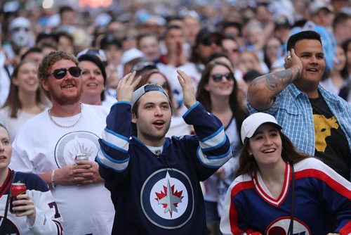 RUTH BONNEVILLE / WINNIPEG FREE PRESS

Thousands of Winnipeg Jets fans scream at the start of the Winnipeg Jets vs Vegas Golden Knights game outside MTS Centre on Donald Street during the fan party Saturday.

Photo of Nico and Mattina Lisi screaming in the front row/  

May 12,  2018
