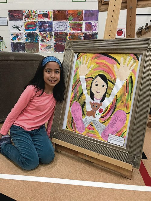 Canstar Community News Belen Infantes, a Grade 3 student at Calvin Christian School, poses with a self-portrait featured in the school's art show on May 10. (SHELDON BIRNIE/CANSTAR/THE HERALD)