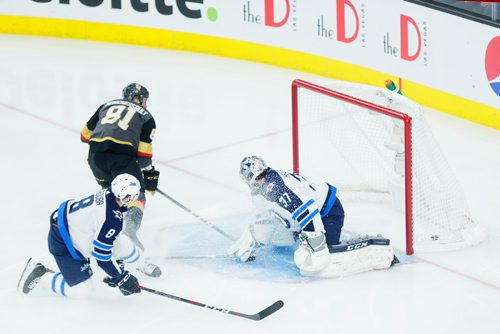 MIKAELA MACKENZIE / WINNIPEG FREE PRESS
Jets goalie Connor Hellebuyck lets one in as Knights forward Jonathan Marchessault and Jets defenceman Jacob Trouba skate up in Game 3 at the T-Mobile Arena in Las Vegas on Wednesday, May 16, 2018.
Mikaela MacKenzie / Winnipeg Free Press 2018.