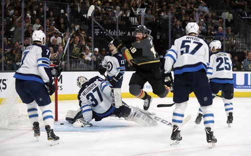 TREVOR HAGAN / WINNIPEG FREE PRESS
Vegas Golden Knights' James Neal (18) scores on Winnipeg Jets' goaltender Connor Hellebuyck (37) with Ben Chiarot (7), Brandon Tanev (13), Tyler Myers (57) and Paul Stastny (25) all in front of the net during the second period of game 3 of the Western Conference Finals in Las Vegas, Nevada, Wednesday, May 16, 2018.