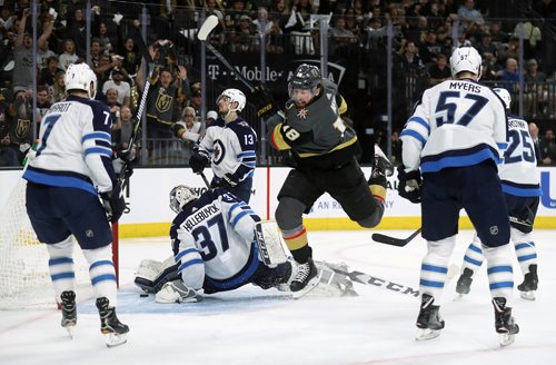 TREVOR HAGAN / WINNIPEG FREE PRESS
Vegas Golden Knights' James Neal (18) scores on Winnipeg Jets' goaltender Connor Hellebuyck (37) with Ben Chiarot (7), Brandon Tanev (13), Tyler Myers (57) and Paul Stastny (25) all in front of the net during the second period of game 3 of the Western Conference Finals in Las Vegas, Nevada, Wednesday, May 16, 2018.