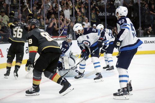 TREVOR HAGAN / WINNIPEG FREE PRESS
Vegas Golden Knights' Alex Tuch (89) scores on on Winnipeg Jets' goaltender Connor Hellebuyck (37) during the second period of game 3 of the Western Conference Finals in Las Vegas, Nevada, Wednesday, May 16, 2018.