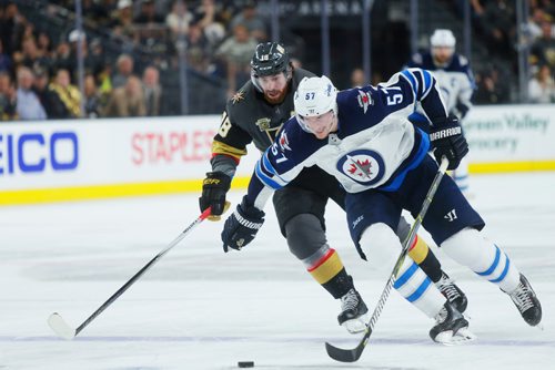 MIKAELA MACKENZIE / WINNIPEG FREE PRESS
Jet defenceman Tyler Myers and Knights forward James Neal race for the puck in Game 3 at the T-Mobile Arena in Las Vegas on Wednesday, May 16, 2018. The game ended 2-3 for the Knights.
Mikaela MacKenzie / Winnipeg Free Press 2018.