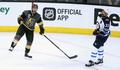 TREVOR HAGAN / WINNIPEG FREE PRESS
Vegas Golden Knights' Jonathan Marchessault (81) celebrates after scoring as Winnipeg Jets' Dustin Byfuglien (33) looks on, during the third period of game 3 of the Western Conference Finals in Las Vegas, Nevada, Wednesday, May 16, 2018.