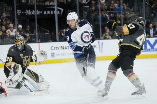 MIKAELA MACKENZIE / WINNIPEG FREE PRESS
Jets forward Patrik Laine bowls past Knights defenceman Luca Sbisa in the third period of Game 3 at the T-Mobile Arena in Las Vegas on Wednesday, May 16, 2018. The game ended 2-3 for the Knights.
Mikaela MacKenzie / Winnipeg Free Press 2018.