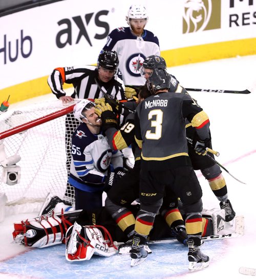 TREVOR HAGAN / WINNIPEG FREE PRESS
Vegas Golden Knights' Alex Tuch (89) pushes Winnipeg Jets' Mark Scheifele (55) as he sits on goaltender Marc-Andre Fleury (29) during the third period of game 3 of the Western Conference Finals in Las Vegas, Nevada, Wednesday, May 16, 2018.