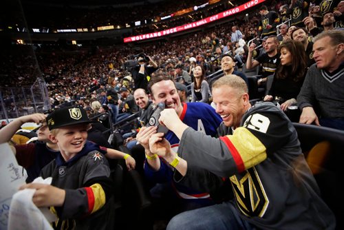 MIKAELA MACKENZIE / WINNIPEG FREE PRESS
Jets fan Dennis Chaisson (left) and his friend, Knights fan George Donaldson, jokingly fight over a Jets cap as the Winnipeg Jets play the Las Vegas Golden Nights in Game 3 at the T-Mobile Arena in Las Vegas on Wednesday, May 16, 2018.
Mikaela MacKenzie / Winnipeg Free Press 2018.