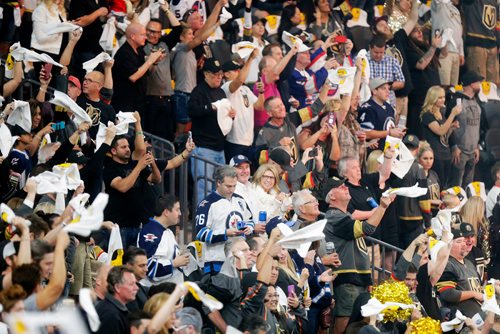 MIKAELA MACKENZIE / WINNIPEG FREE PRESS
A Jets fan texts as Knights fans cheer around him before the Winnipeg Jets play the Las Vegas Golden Nights in Game 3 at the T-Mobile Arena in Las Vegas on Wednesday, May 16, 2018.
Mikaela MacKenzie / Winnipeg Free Press 2018.