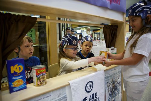 MIKE DEAL / WINNIPEG FREE PRESS
Kindergarten students at Island Lakes School made a bunch of Jets cheer gear and are giving the items to other students who bring in food for Winnipeg Harvest Friday morning.  
180518 - Friday, May 18, 2018.