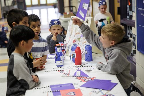 MIKE DEAL / WINNIPEG FREE PRESS
Kindergarten students at Island Lakes School made a bunch of Jets cheer gear and are giving the items to other students who bring in food for Winnipeg Harvest Friday morning.  
180518 - Friday, May 18, 2018.