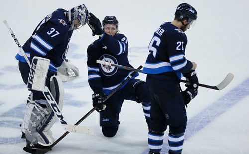 JOHN WOODS/ WINNIPEG FREE PRESS
Winnipeg Jets goaltender Connor Hellebuyck (37), Patrik Laine (29) and Blake Wheeler (26) lose game five and the NHL Western Conference Final against the Vegas Golden Knights in Winnipeg on Sunday, May 20, 2018.