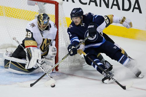 JOHN WOODS/ WINNIPEG FREE PRESS
Winnipeg Jets' Jack Roslovic (52) attempts the wraparound on Vegas Golden Knights goaltender Marc-Andre Fleury (29) as Erik Haula (56) defends during third period of game five action in the NHL Western Conference Final in Winnipeg on Sunday, May 20, 2018.