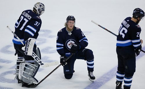 JOHN WOODS/ WINNIPEG FREE PRESS
Winnipeg Jets goaltender Connor Hellebuyck (37), Patrik Laine (29) and Blake Wheeler (26) lose game five and the NHL Western Conference Final against the Vegas Golden Knights in Winnipeg on Sunday, May 20, 2018.