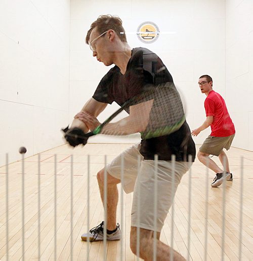 PHIL HOSSACK / WINNIPEG FREE PRESS - NATIONAL RAQUETBALL TOURNAMENT - Brandon's Curtis Cullen goes back for the return as Calgary's Mitch Brayley gets out of the way in doubles play Monday afternoon.  - MAY 21, 2018.