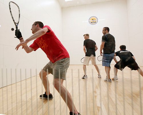 PHIL HOSSACK / WINNIPEG FREE PRESS - NATIONAL RAQUETBALL TOURNAMENT - Calgary's Mitch Brayley makes the return as (L-R) Brandon's Curtis Cullen, Calgary's Paul Albert, and Tanner Prentice of Macrovie Sask wait in doubles play Monday afternoon.  - MAY 21, 2018.