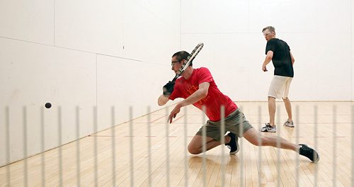 PHIL HOSSACK / WINNIPEG FREE PRESS - NATIONAL RAQUETBALL TOURNAMENT - Calgary's Mitch Brayley makes the return as (L-R) Brandon's Curtis Cullen waits in doubles play Monday afternoon.  - MAY 21, 2018.