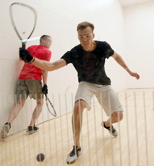 PHIL HOSSACK / WINNIPEG FREE PRESS - NATIONAL RAQUETBALL TOURNAMENT - Brandon's Curtis Cullen goes back for the return as Calgary's Mitch Brayley gets out of the way in doubles play Monday afternoon. .- MAY 21, 2018.