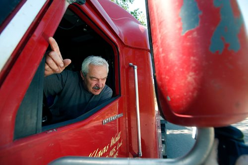 PHIL HOSSACK / WINNIPEG FREE PRESS - Klaas Wall gestures while describing the need for the popular rest stop after he stopped his rig and a load of timber destined for Kenora at the Pinegrove Rest Stop parking lot Tuesday afternoon as a steady stream of traffic pulled in to use the facilities.  - MAY 17, 2018.